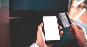 using-laptop-credit-card-mobile-phone-buy-payment-goods_122732-862